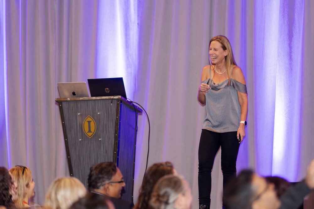 Ilana Golan speaking on stage